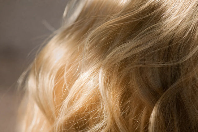 Glossy platinum blonde waves, a bleached hair repair guide.