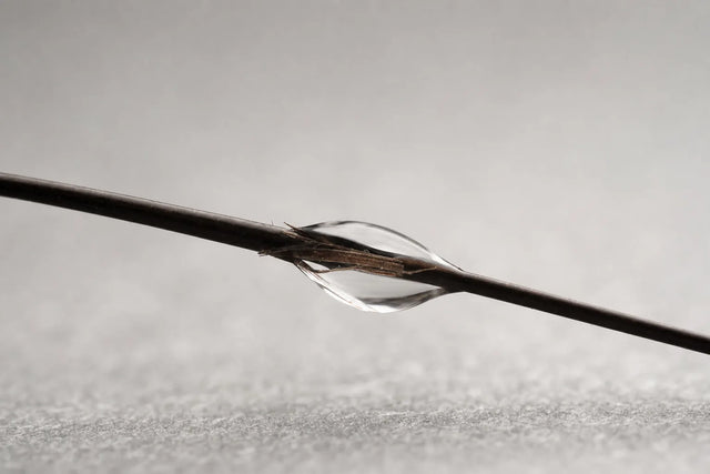 A product droplet wrapping a single frayed fibre, do bond builders work.