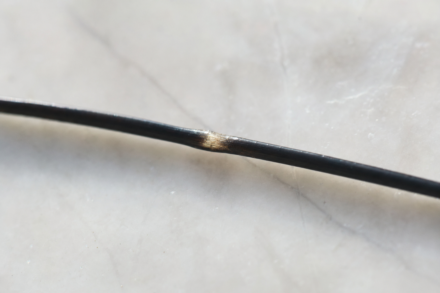 A single hair fibre seamlessly mended, hair bond repair.